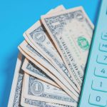 calculator and dollars